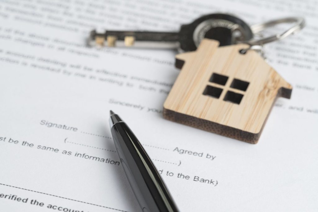 Executor organizing documents needed to sell a probate house in Central Connecticut