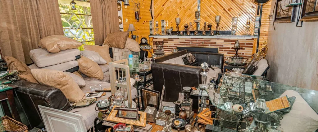 Homeowner reviewing cleanup and as-is selling options for a hoarder house in Central Connecticut
